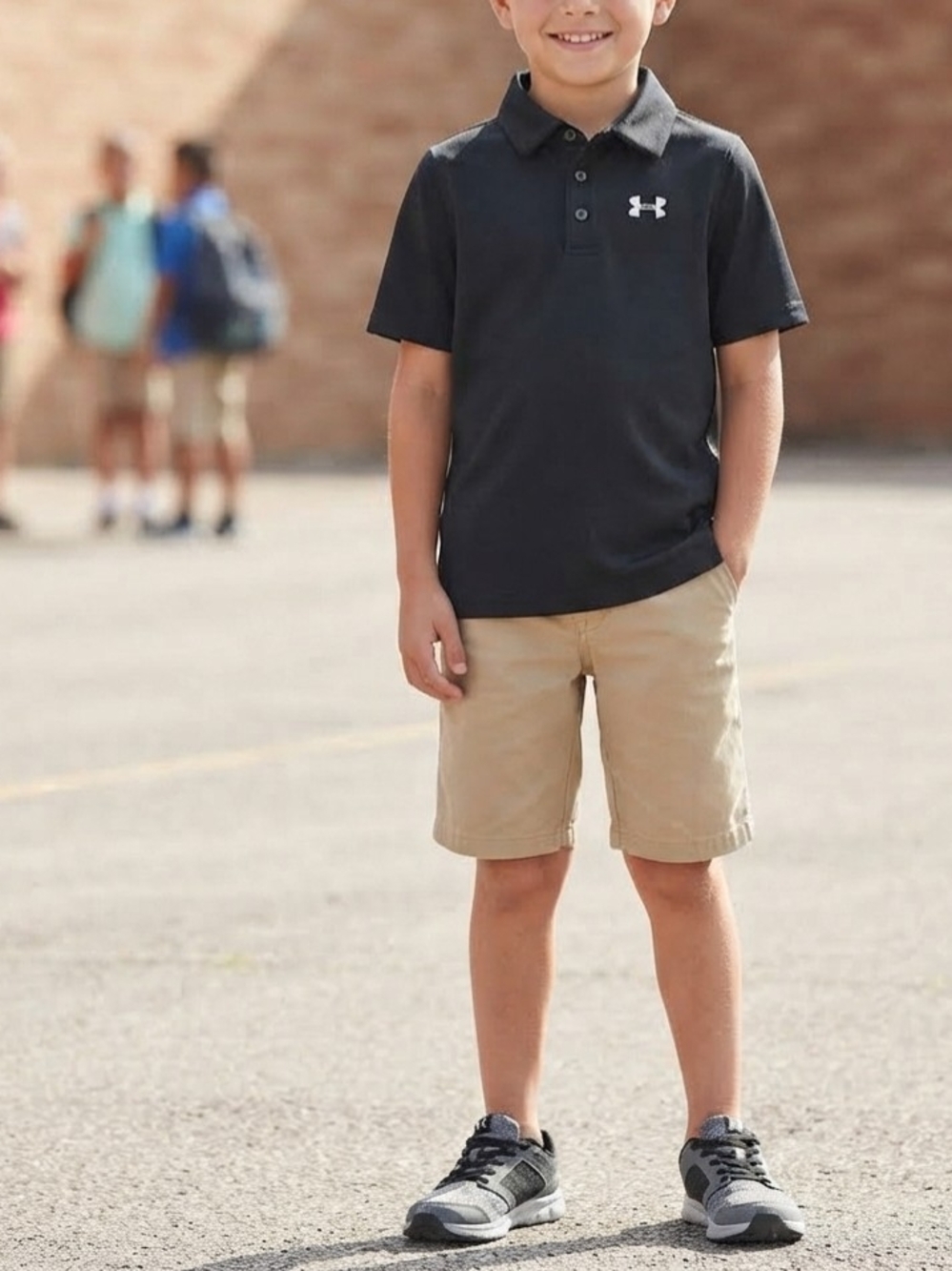 Under Armour HeatGear Boys L Black Loose Fit Short Sleeve Polo Shirt Logo